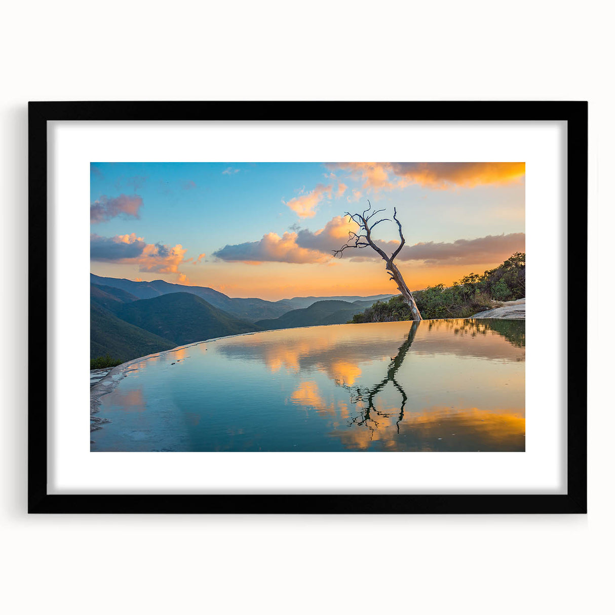 Extra large abstract art print depicting a vibrant, colorful Oaxacan landscape on a textured canvas, framed in black.