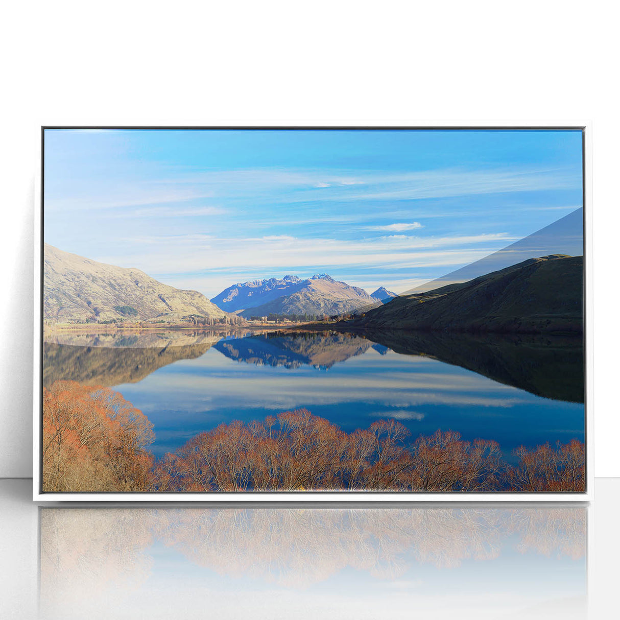 Art deco poster of Otago, New Zealand scenery in soft blue and green tones, framed in white acrylic.