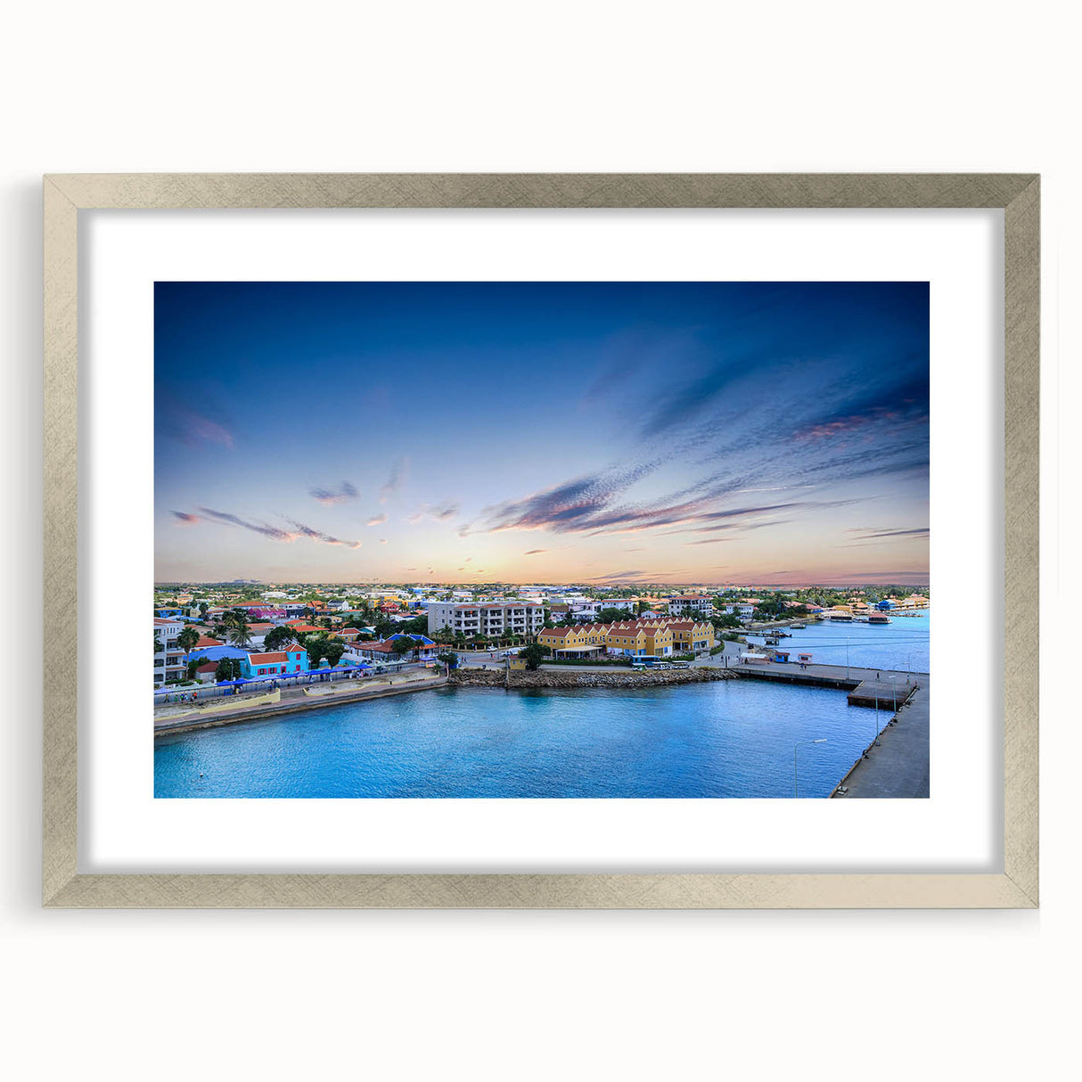 Extra large abstract art print of Caribbean scenery in muted blue and green tones, framed in silver.