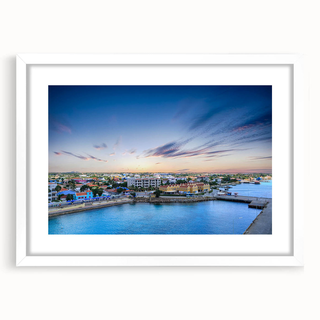 Textured abstract art print of a Caribbean scenery in muted blue and green shades, framed with a white mat.