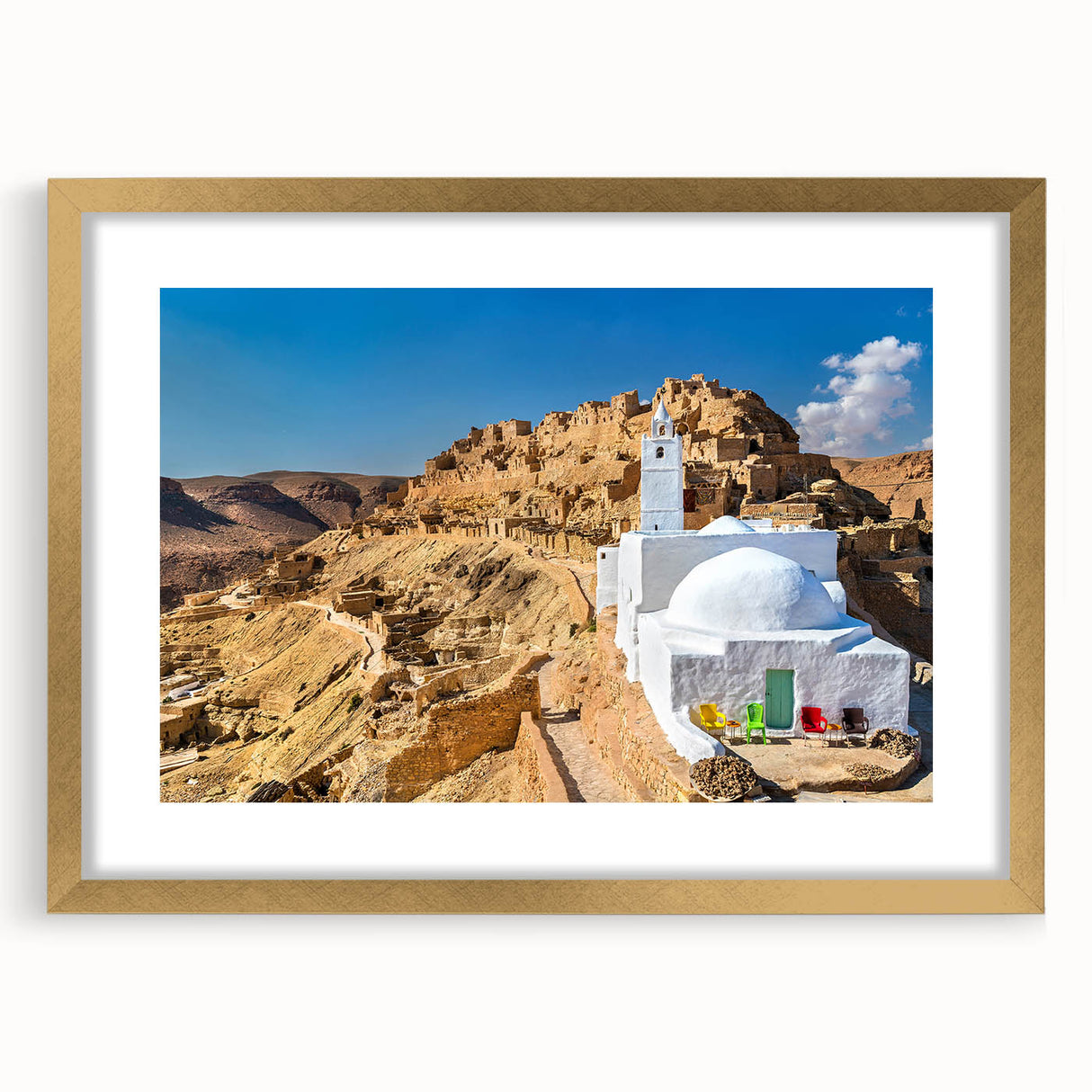 Extra large abstract art print of a textured Tunisian landscape in muted earth tones, framed in gold.