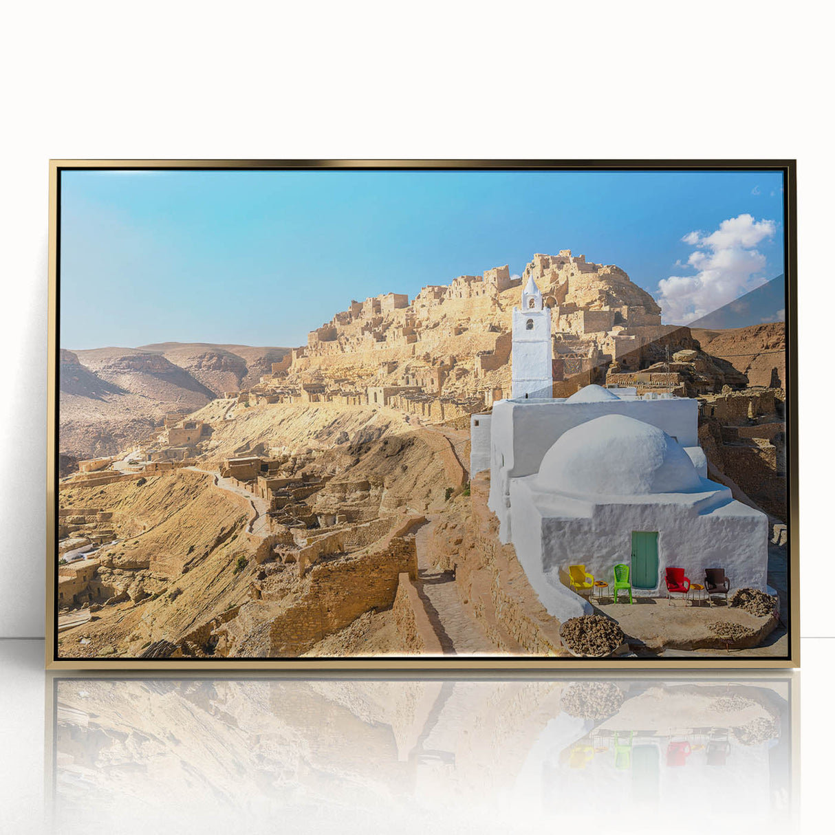 Large acrylic print of a Tunisian landscape in gold frame, featuring mid-century modernist style.