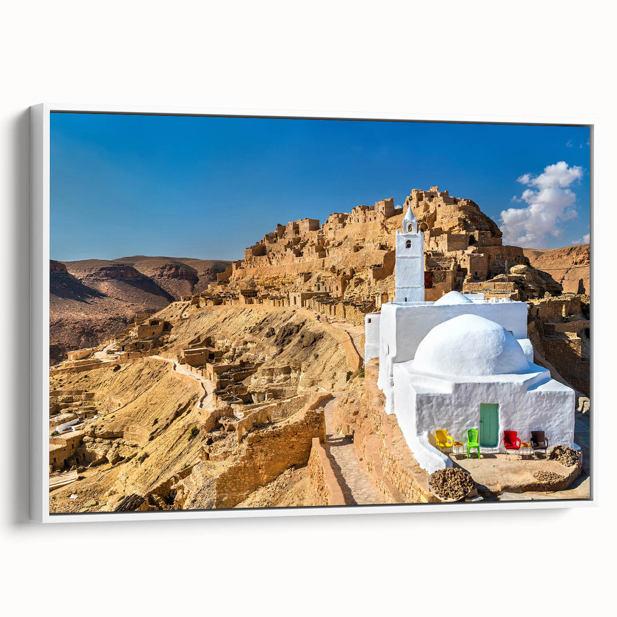 Vintage poster art of a Tunisian landscape on framed canvas, featuring vivid colors, ideal for living room decor.
