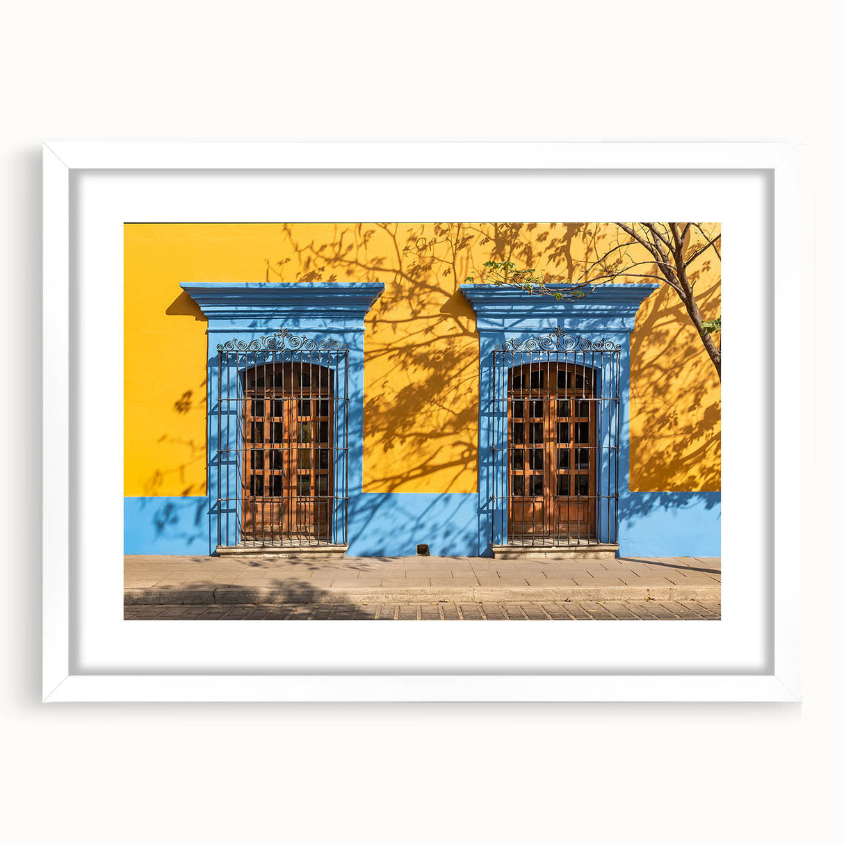 Abstract art print of Oaxaca scenery in muted earth tones, framed with a white mat.