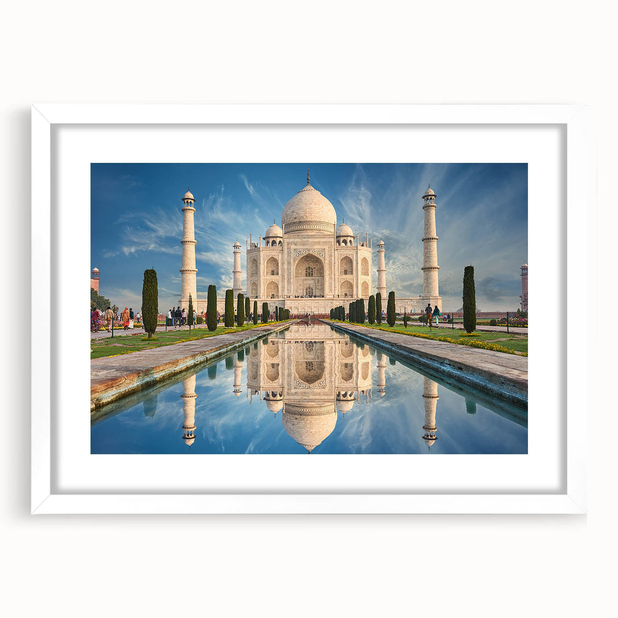 Abstract art print of Indian scenery in muted earth tones on a framed white mat, suitable for dining room decor.