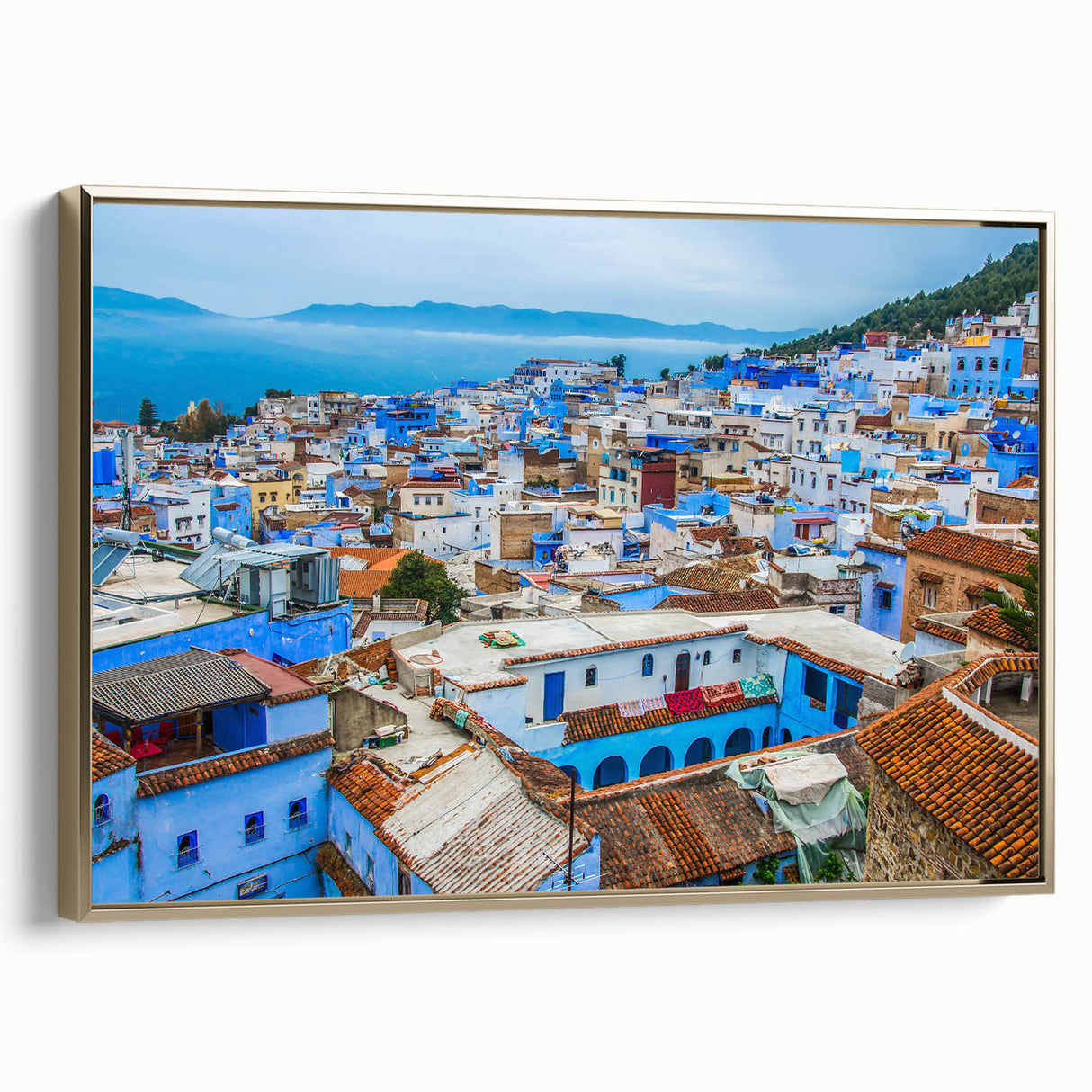 Framed canvas of a Moroccan landscape with vintage poster art style, featuring colorful scenery against a black background.