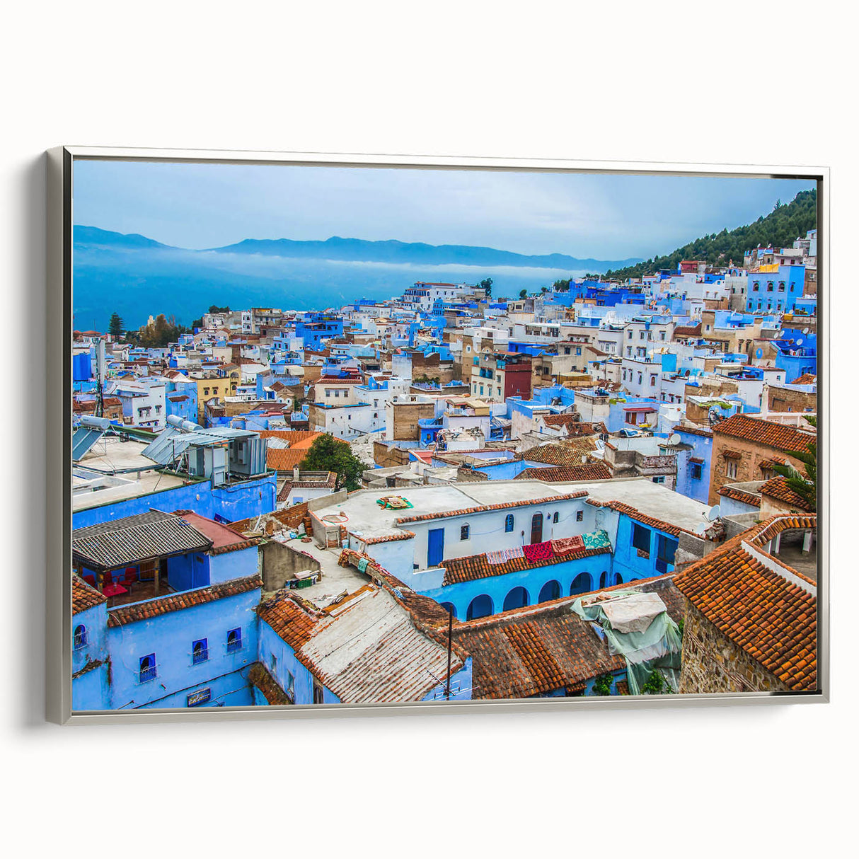 Vintage poster art of a Moroccan landscape on framed canvas, featuring a black and colorful palette.