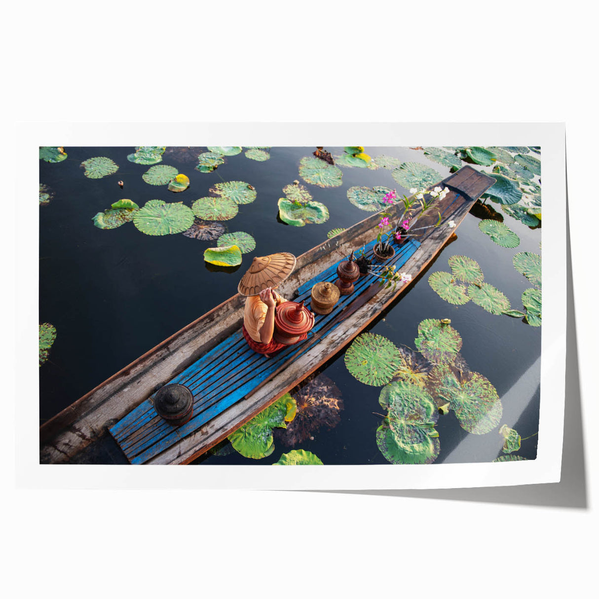 Rolled print of a Myanmar landscape with lush greenery and temple, in soft earth tones, suitable for dining room decor.