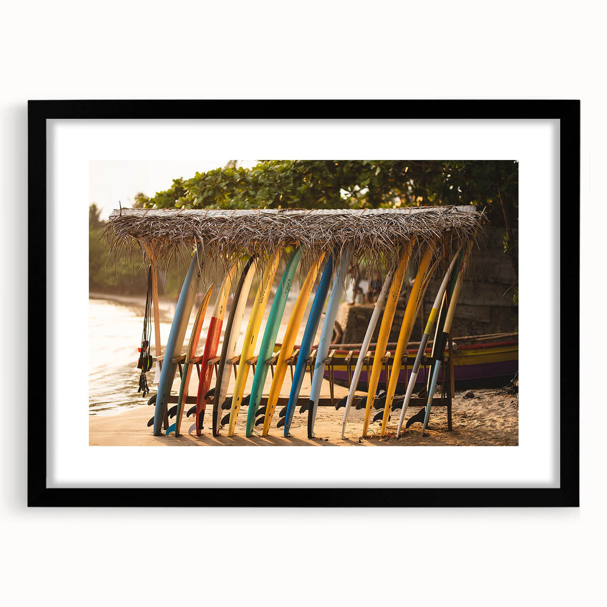 Colorful abstract art print of a vibrant, textured scenery, framed with a black mat, ideal for living room decor.