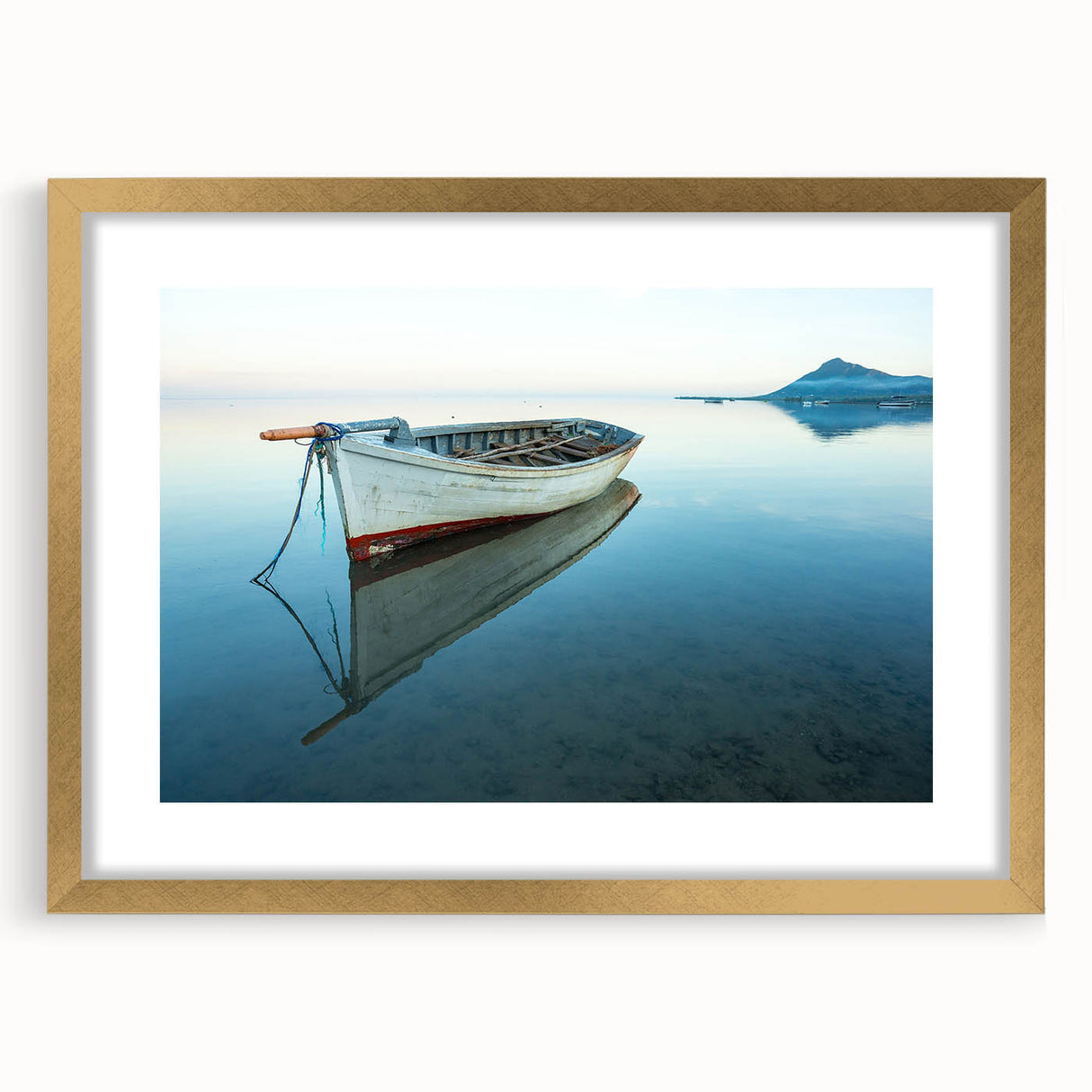 Abstract art print of a Caribbean scenery in muted blue and green tones, framed in gold, suitable for dining room decor.