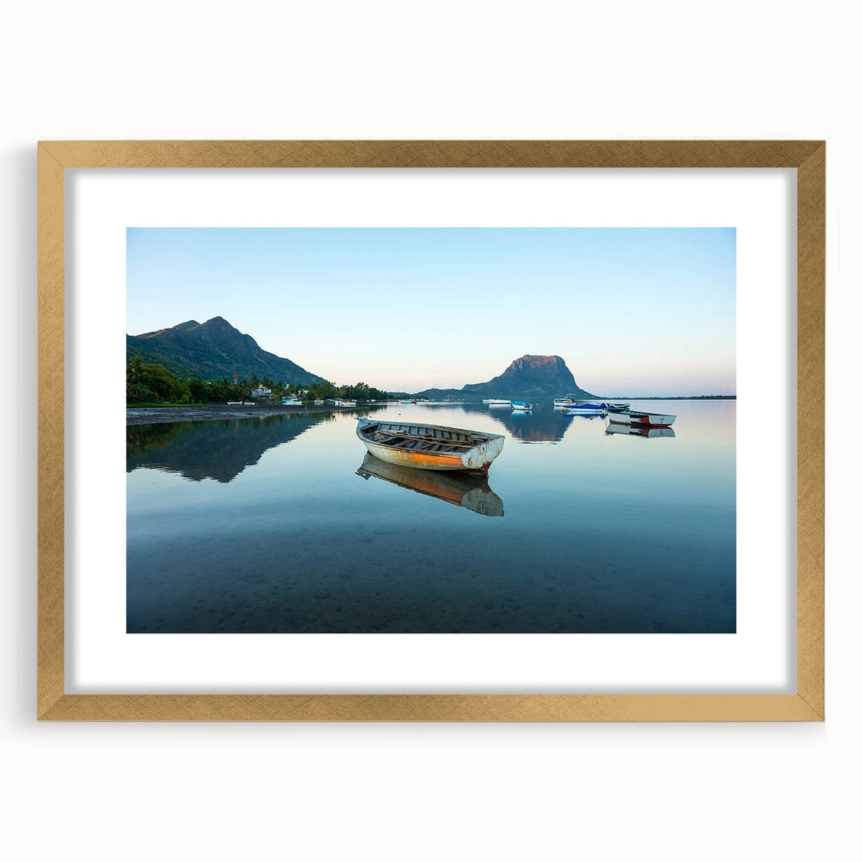 Abstract art print of Caribbean scenery in muted blue and green, framed in gold, suitable for dining room decor.