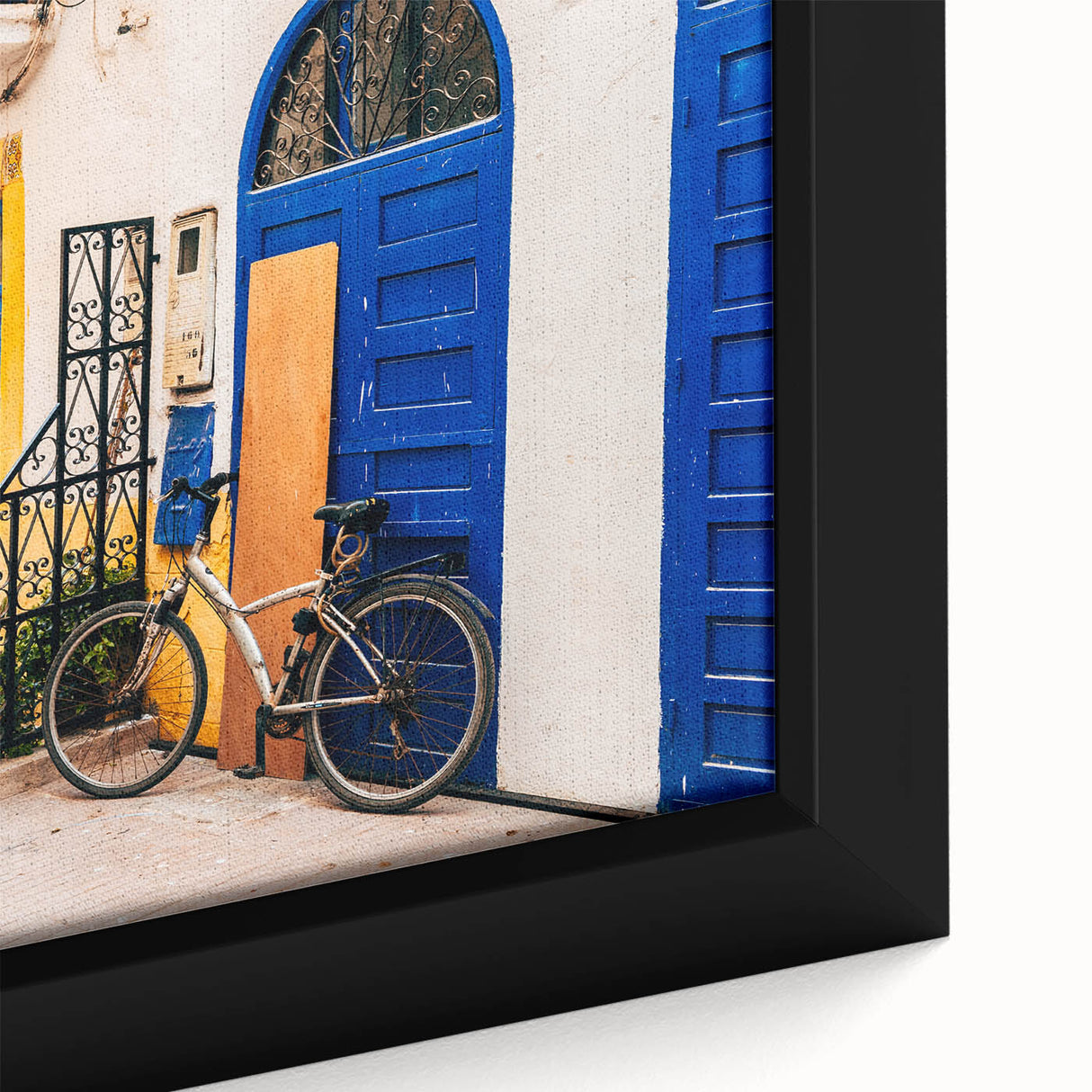 Extra large framed canvas featuring a textured black wall art scene of a Moroccan landscape with vibrant, colorful accents.