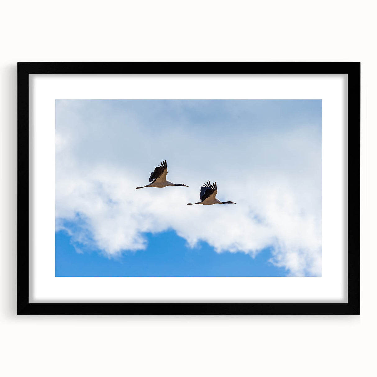 Extra large abstract art print featuring a textured, colorful depiction of Bhutanese scenery on a black-framed canvas.