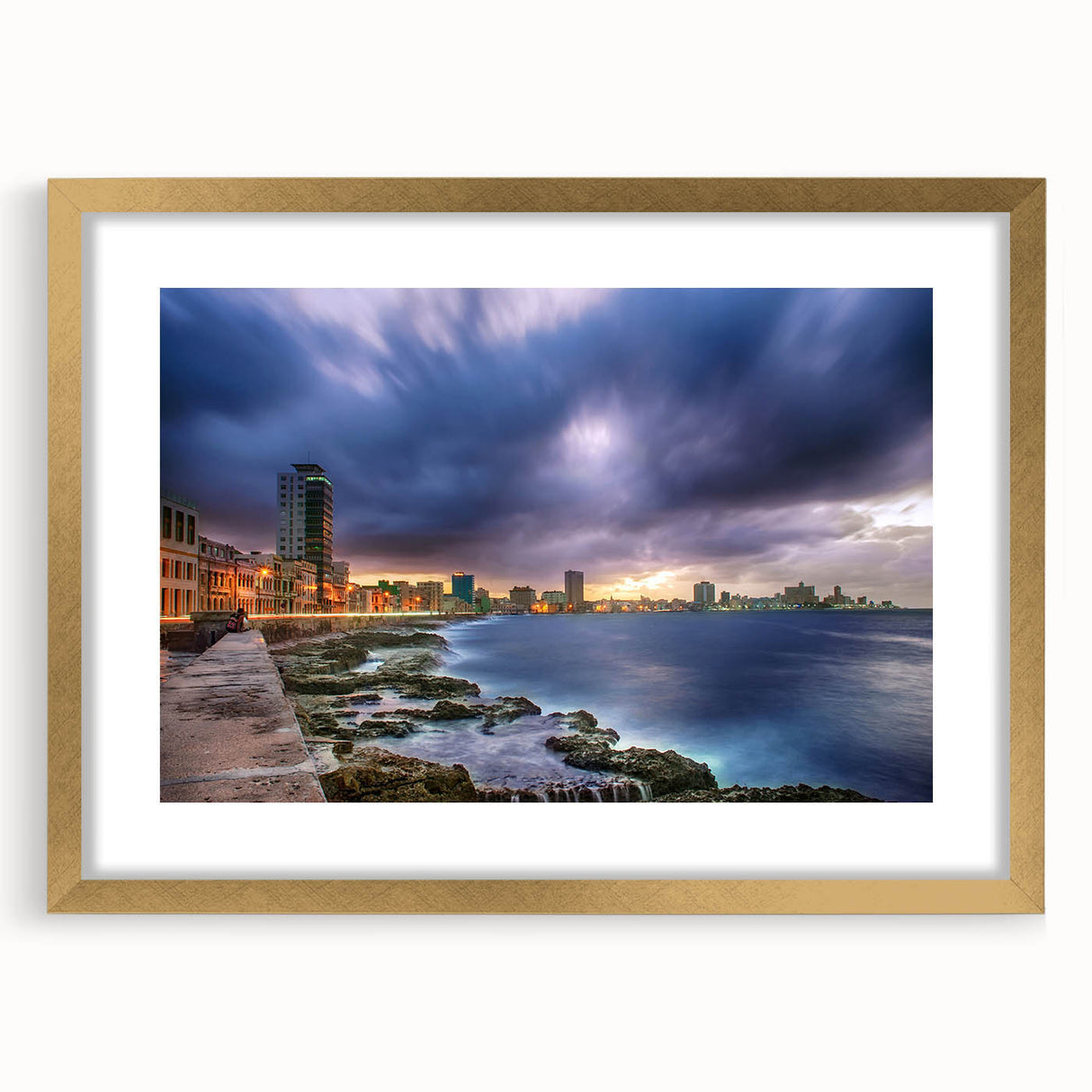 Abstract art print of a Caribbean scene in vibrant blue and green tones, framed in gold, suitable for dining room decor.