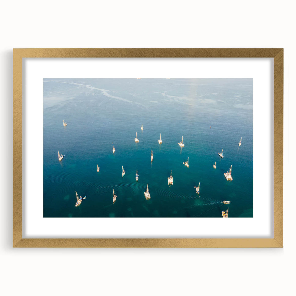 Abstract art print of a Caribbean scenery in muted blue and green tones, framed in gold, ideal for dining room decor.