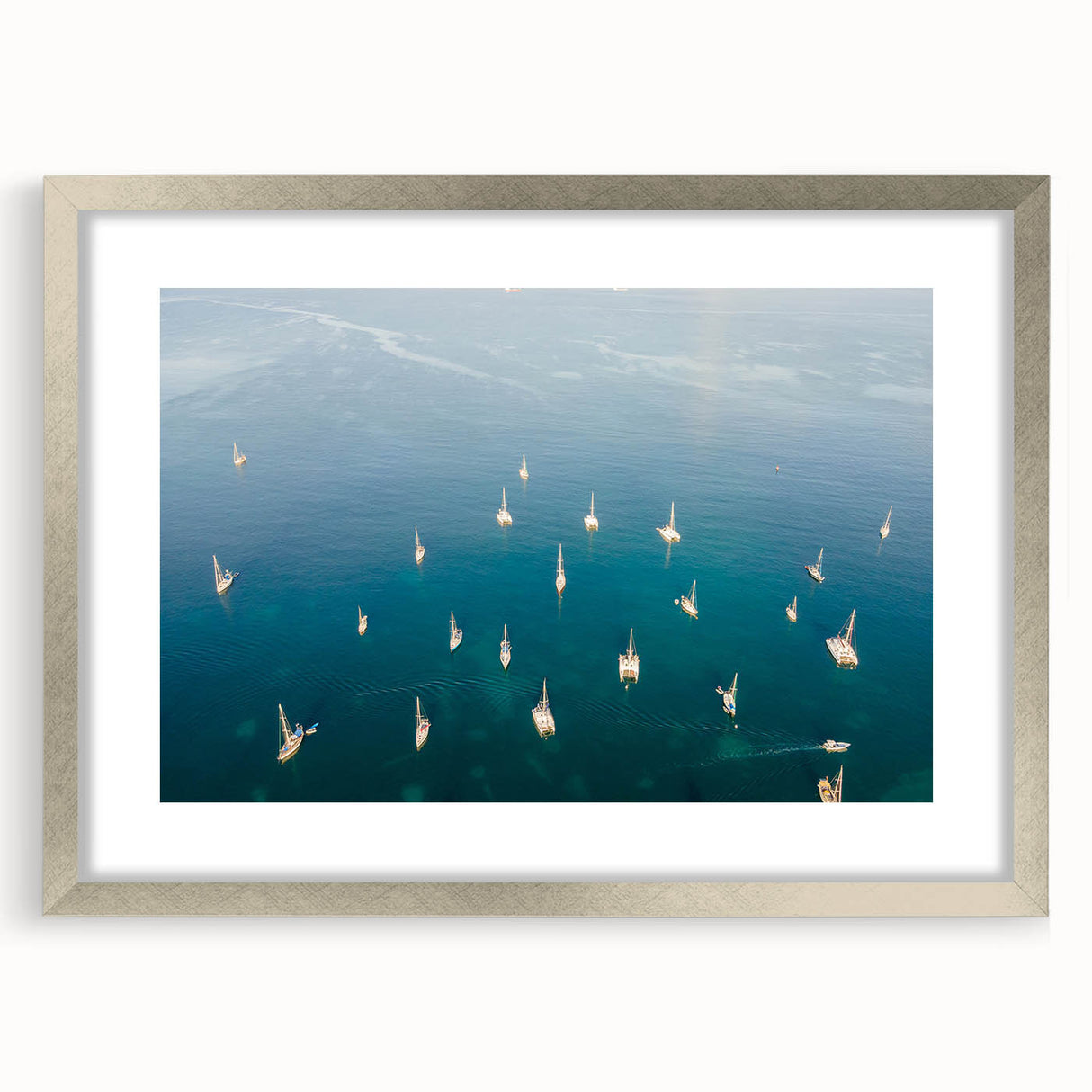 Extra large abstract art print of Caribbean scenery in muted blue and green tones on a framed canvas.