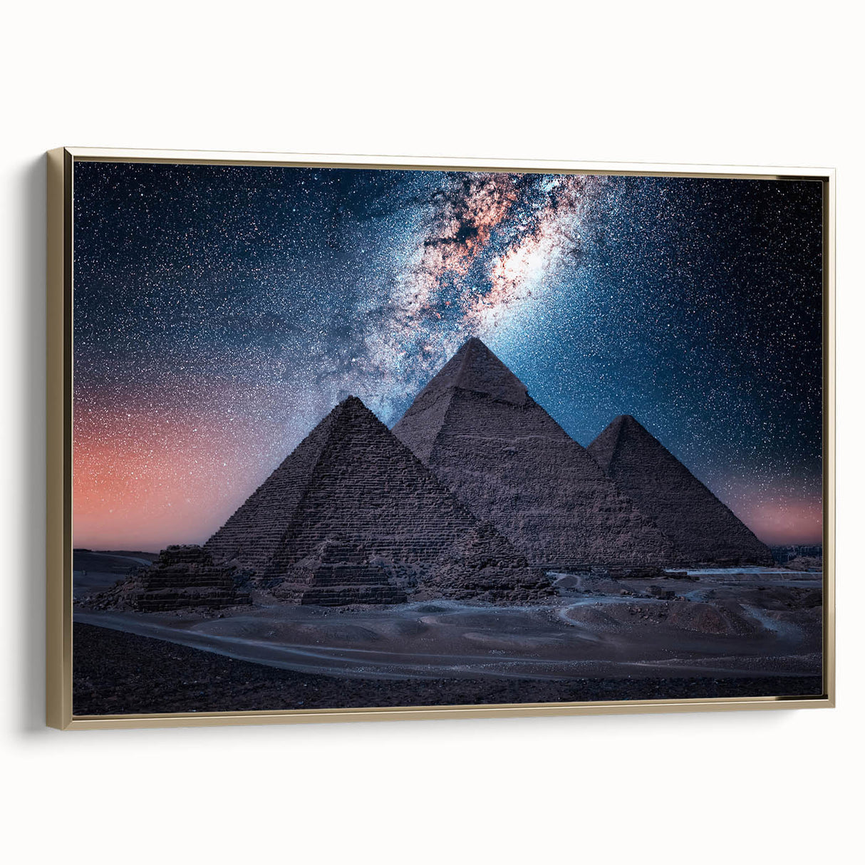 Framed canvas featuring a vintage-style landscape painting of an Egyptian scene in gold, black, and vibrant colors.