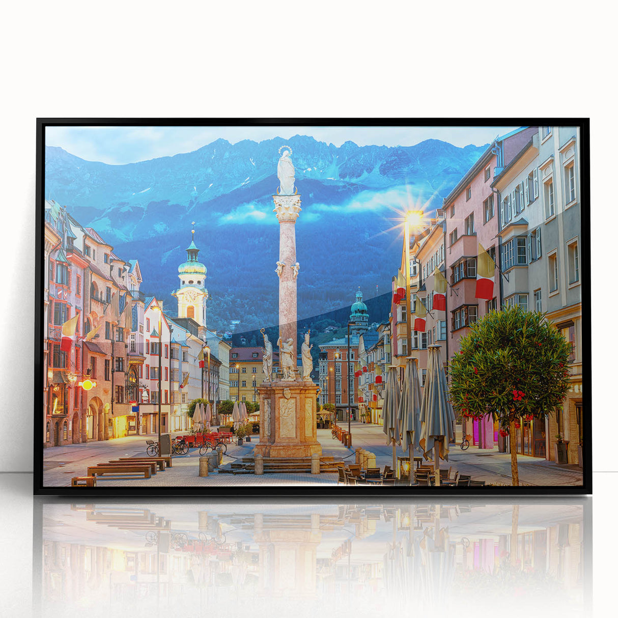 Large abstract wall art of a European landscape in muted earth tones, framed in black acrylic.