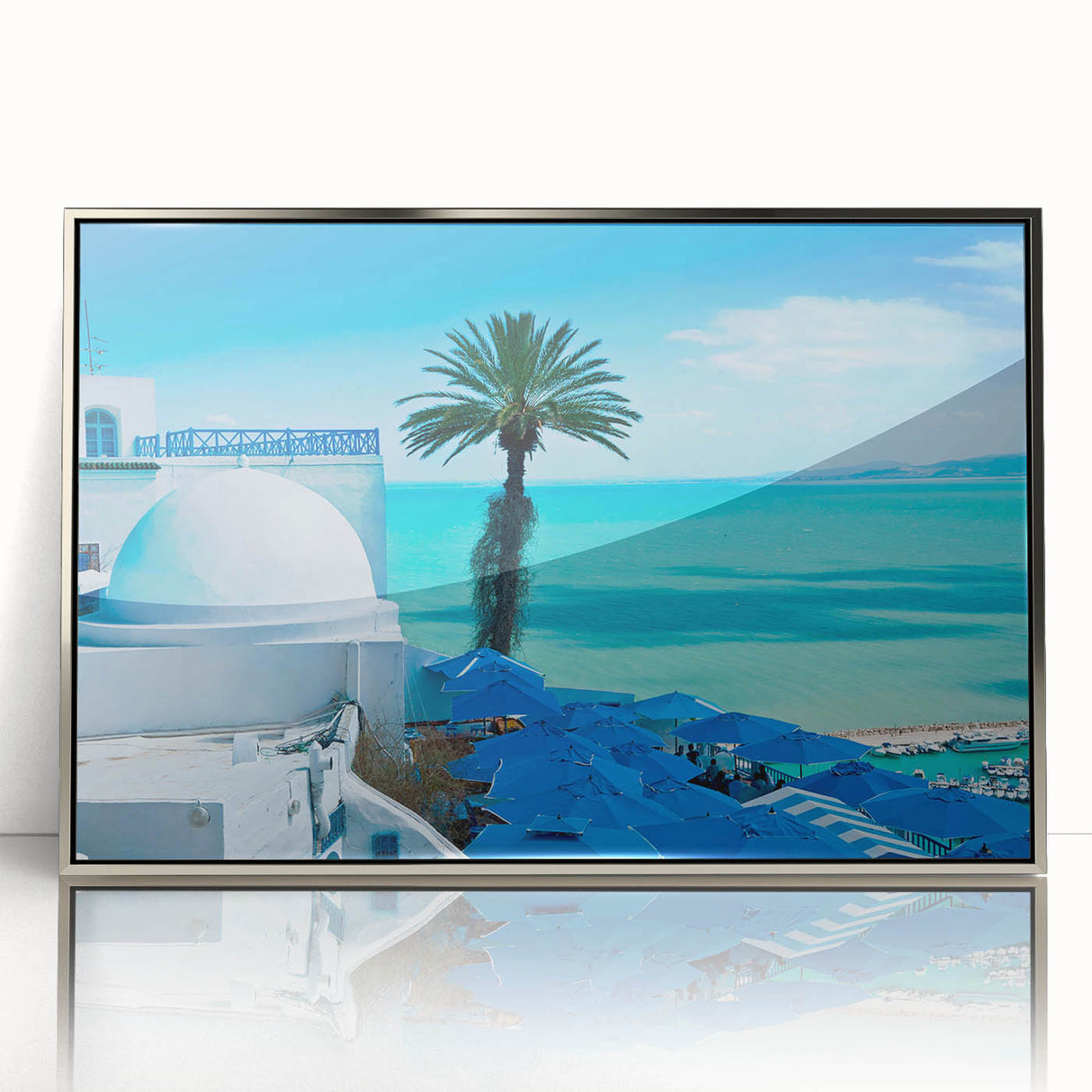 Mid-century modernist art depicting Tunisian scenery in muted earth tones on a silver-framed acrylic print.