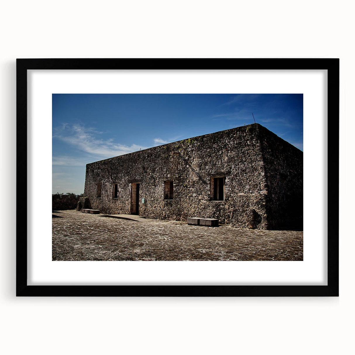 Colorful abstract art print of Quintana Roo scenery in vivid shades on a large framed canvas, ideal for living room decor.