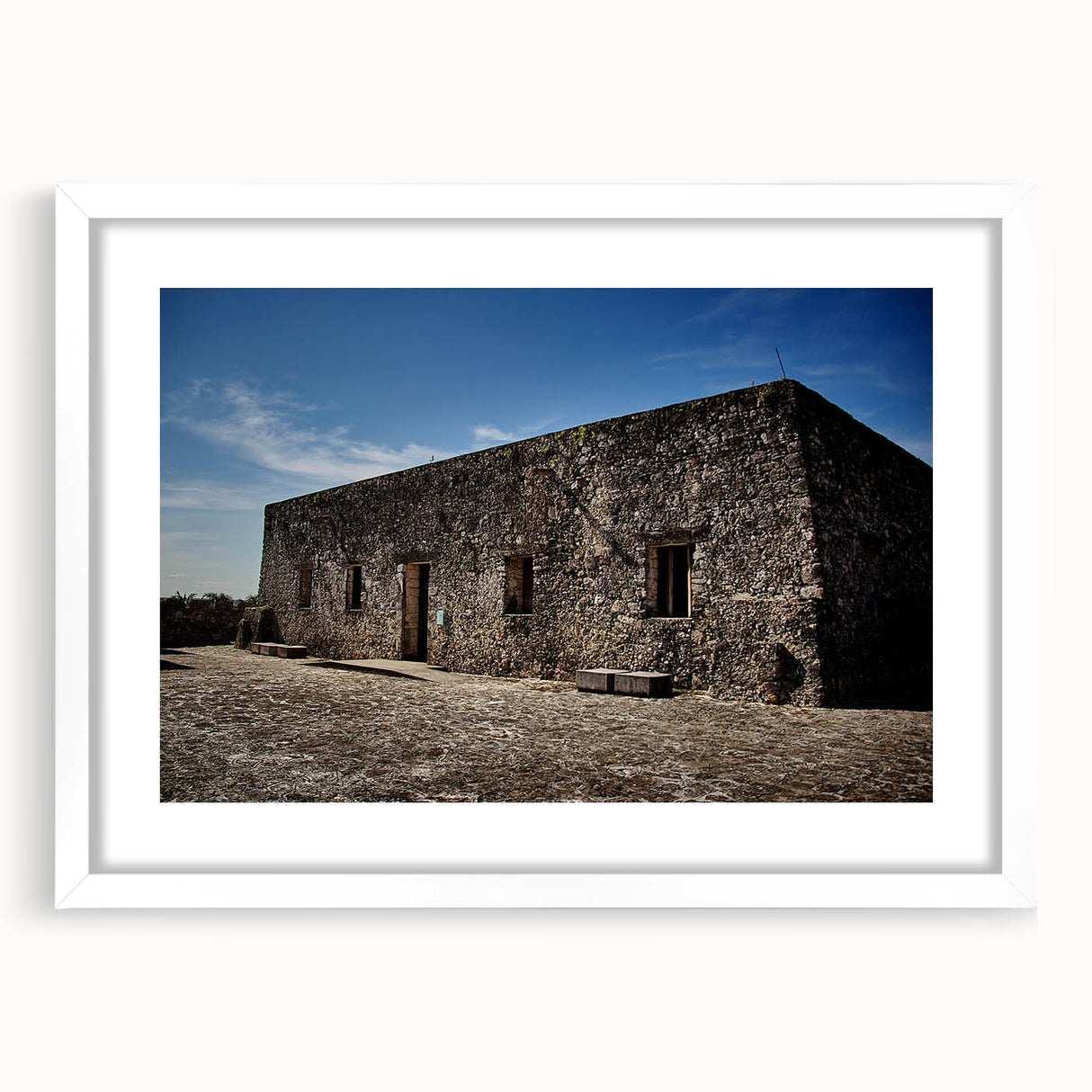 Abstract art print of Quintana Roo scenery in muted blue and green tones, framed with a white mat.
