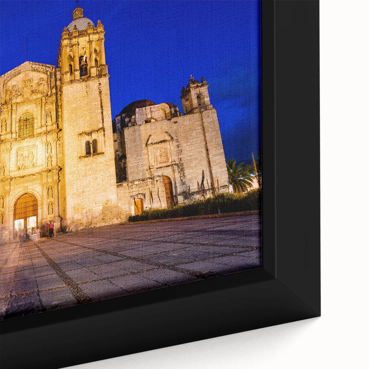 Framed canvas featuring a textured depiction of Oaxaca, Mexico in black with vibrant, colorful accents.