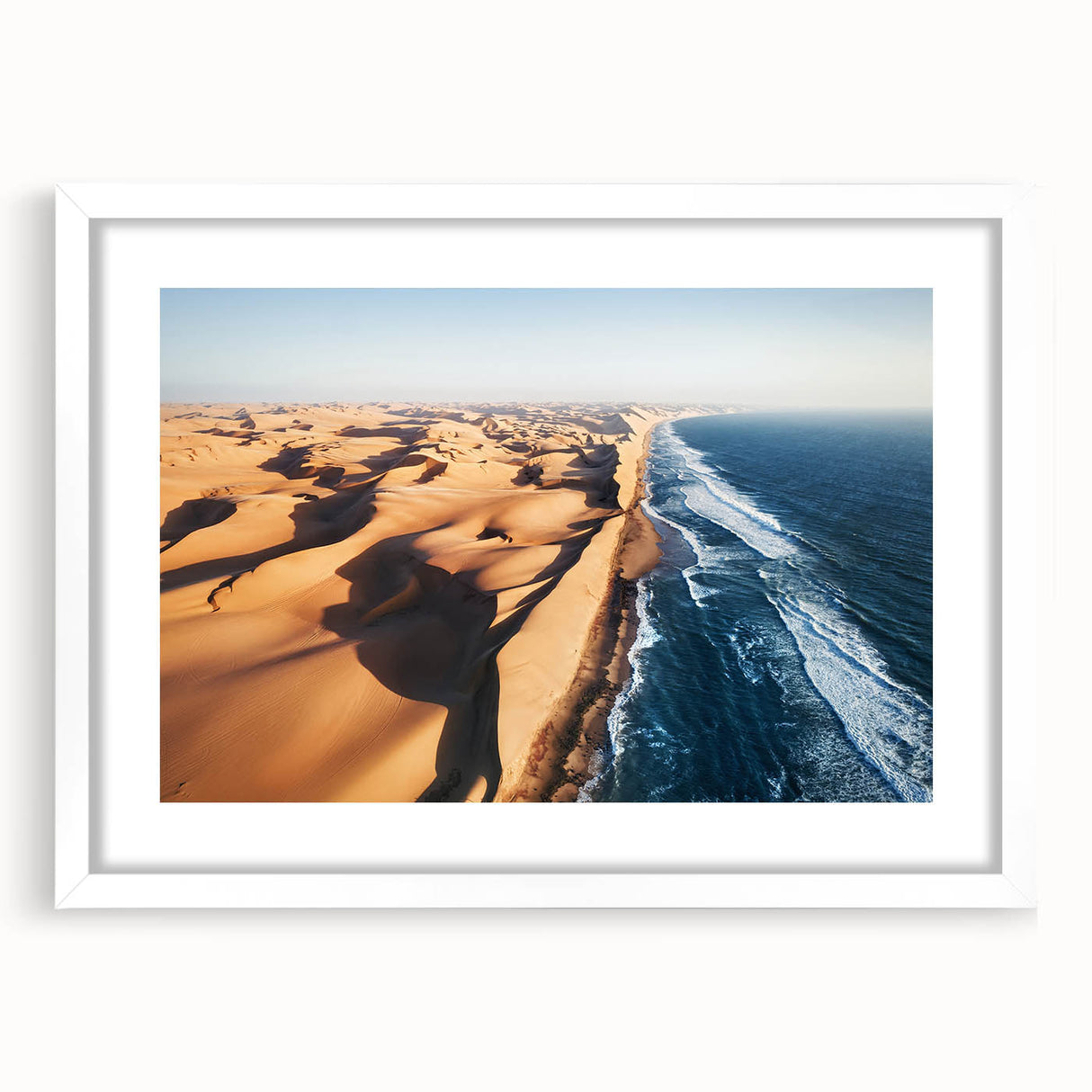 Extra large abstract art print depicting a textured Namibian landscape in muted earth tones, framed with a white mat.