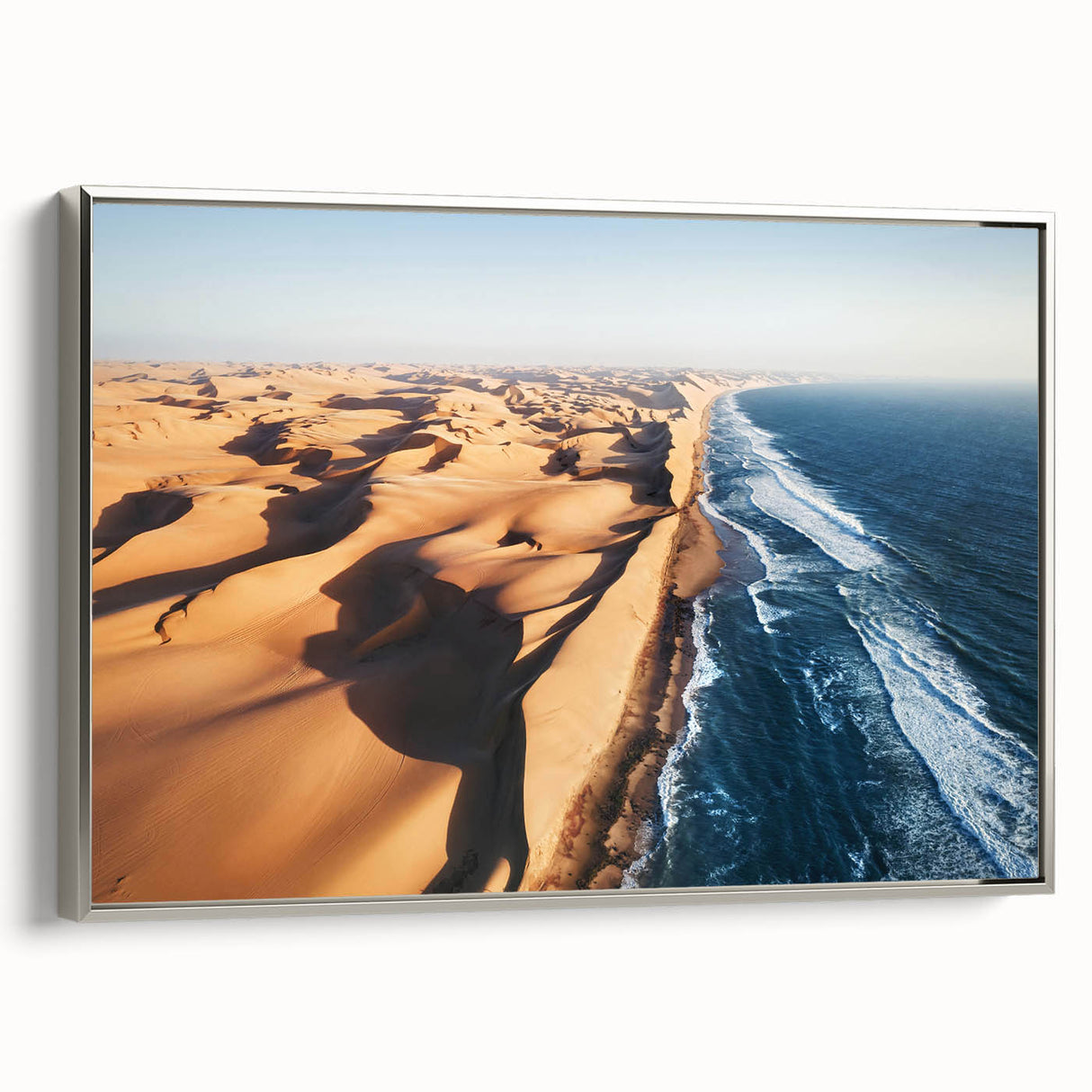 Vintage poster art of a Namibian landscape on a large framed canvas, featuring vivid colors against a black background.