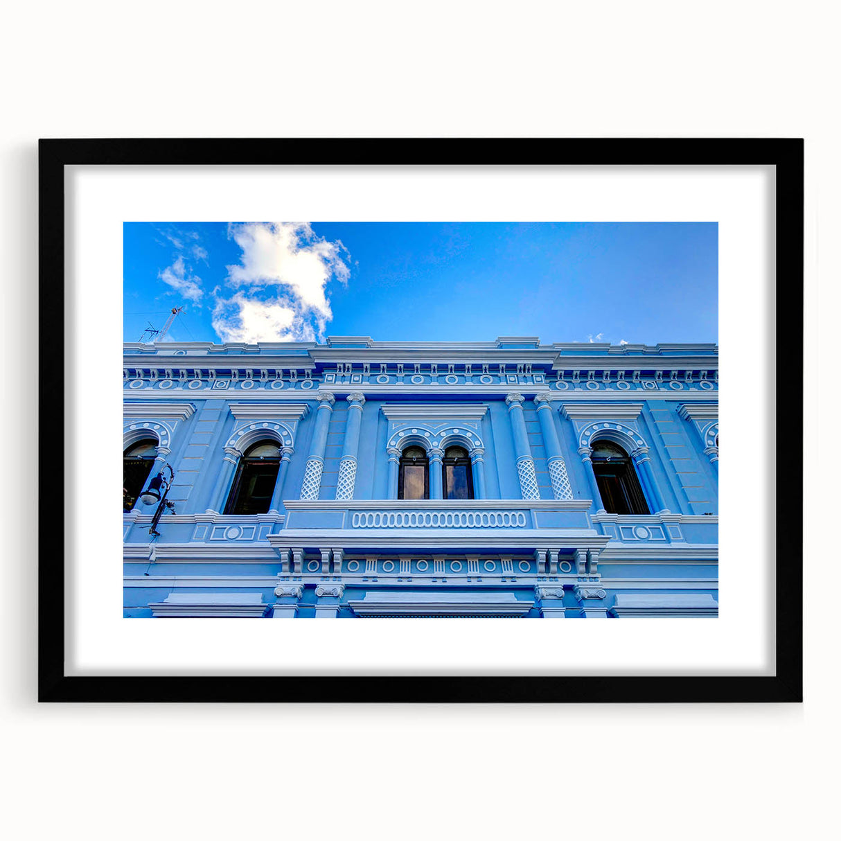 Extra large abstract art print depicting vibrant, colorful Mexican Yucatan scenery on a textured canvas, framed in black.