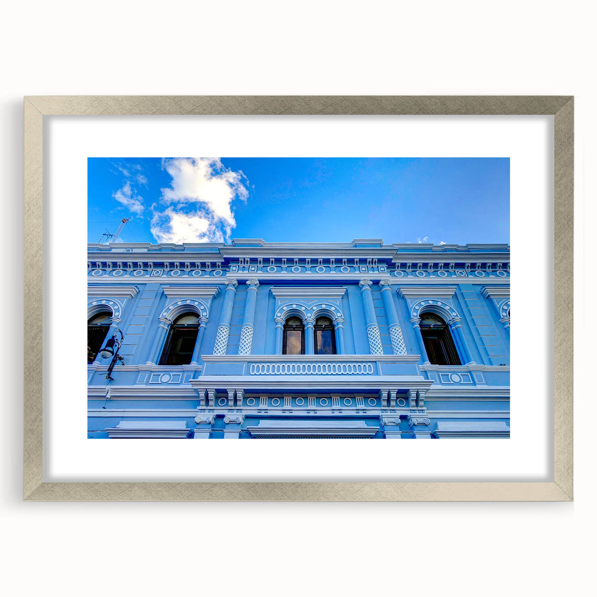 Textured abstract art print of Yucatán scenery in muted earth tones, framed in silver, suitable for bedroom art.