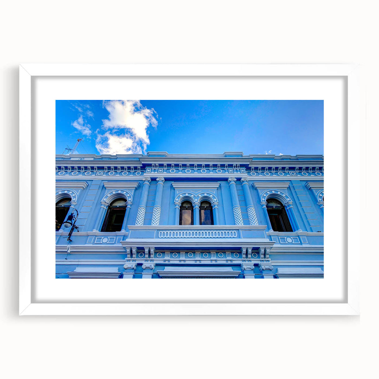 Abstract art print depicting a vibrant Yucatan landscape on a white-framed mat, ideal for dining room decor.