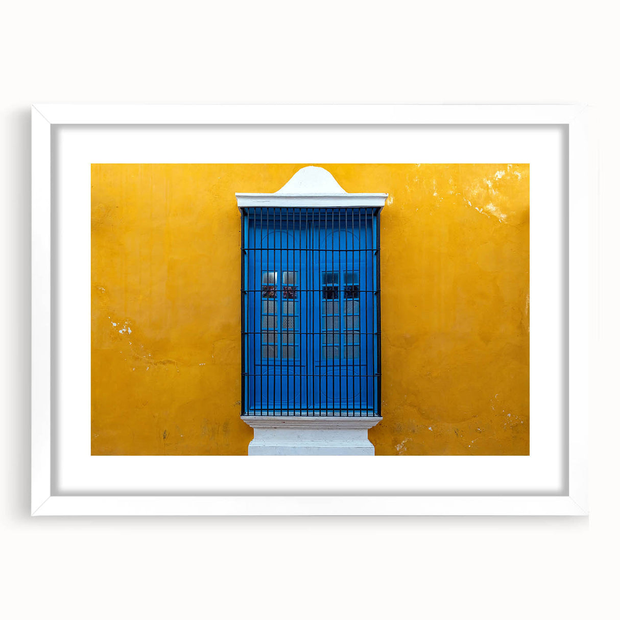 Abstract art print of Yucatan scenery in muted earth tones on a framed white mat, suitable for dining room decor.