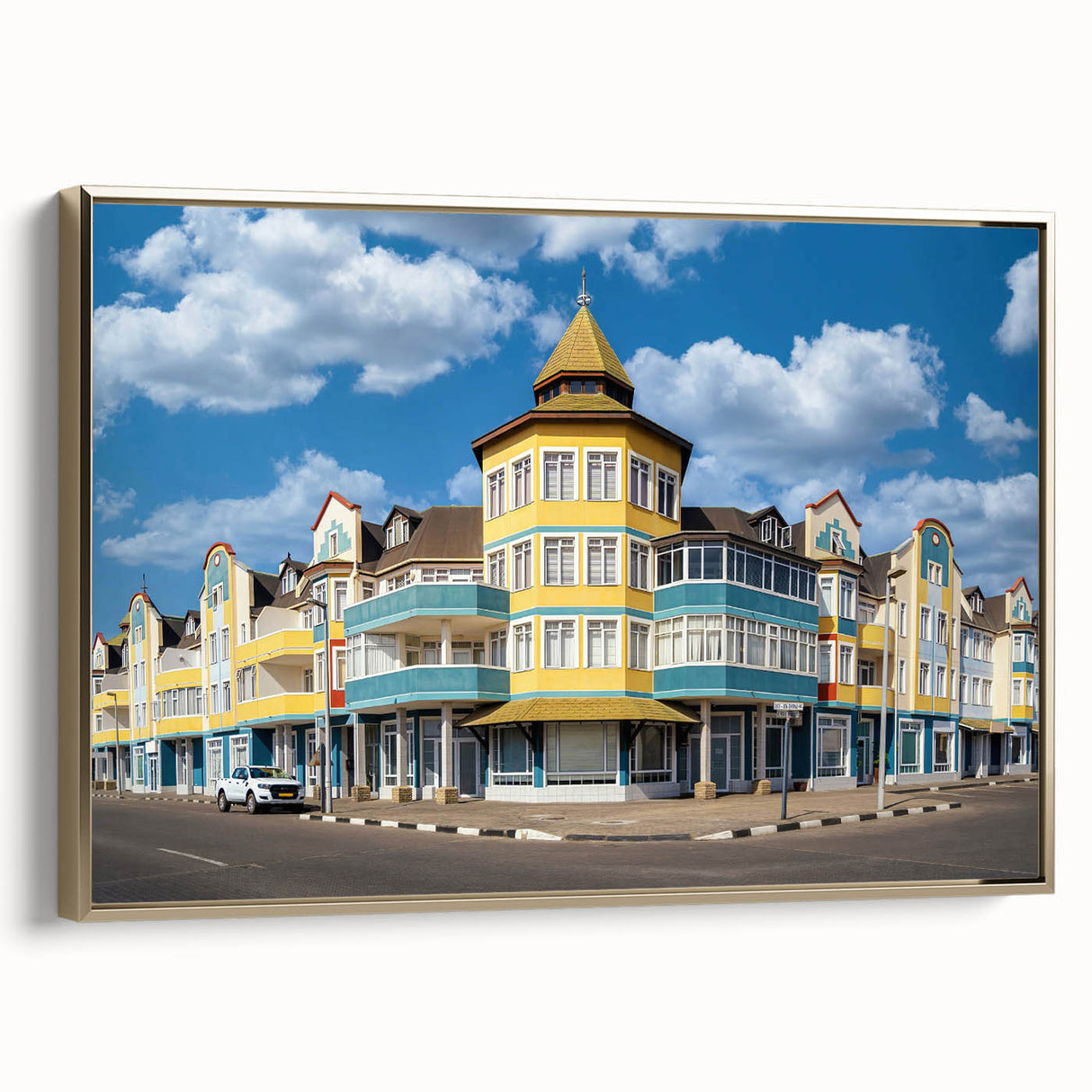 Framed canvas featuring a vibrant, colorful landscape art painting of the Namibian desert.