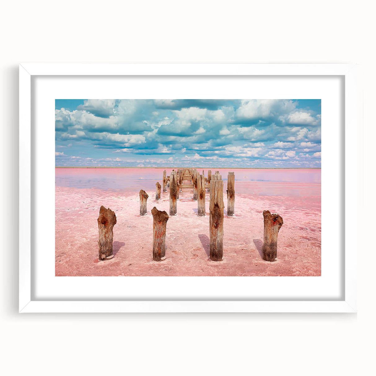Abstract art print of Yucatan scenery in muted green and blue tones on a white framed canvas.