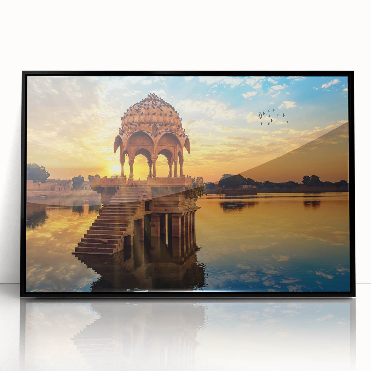 Large abstract wall art depicting a stylized Indian landscape in vibrant orange and red tones on a black acrylic frame.