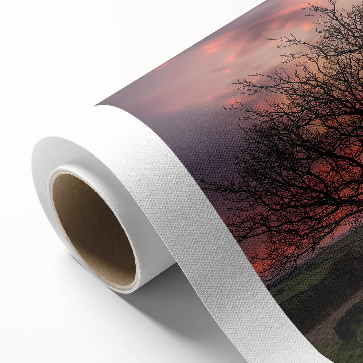 Rolled canvas artwork showcasing a vibrant landscape with a rustic barn, highlighting rich colors and intricate details, securely packaged in a protective tube.