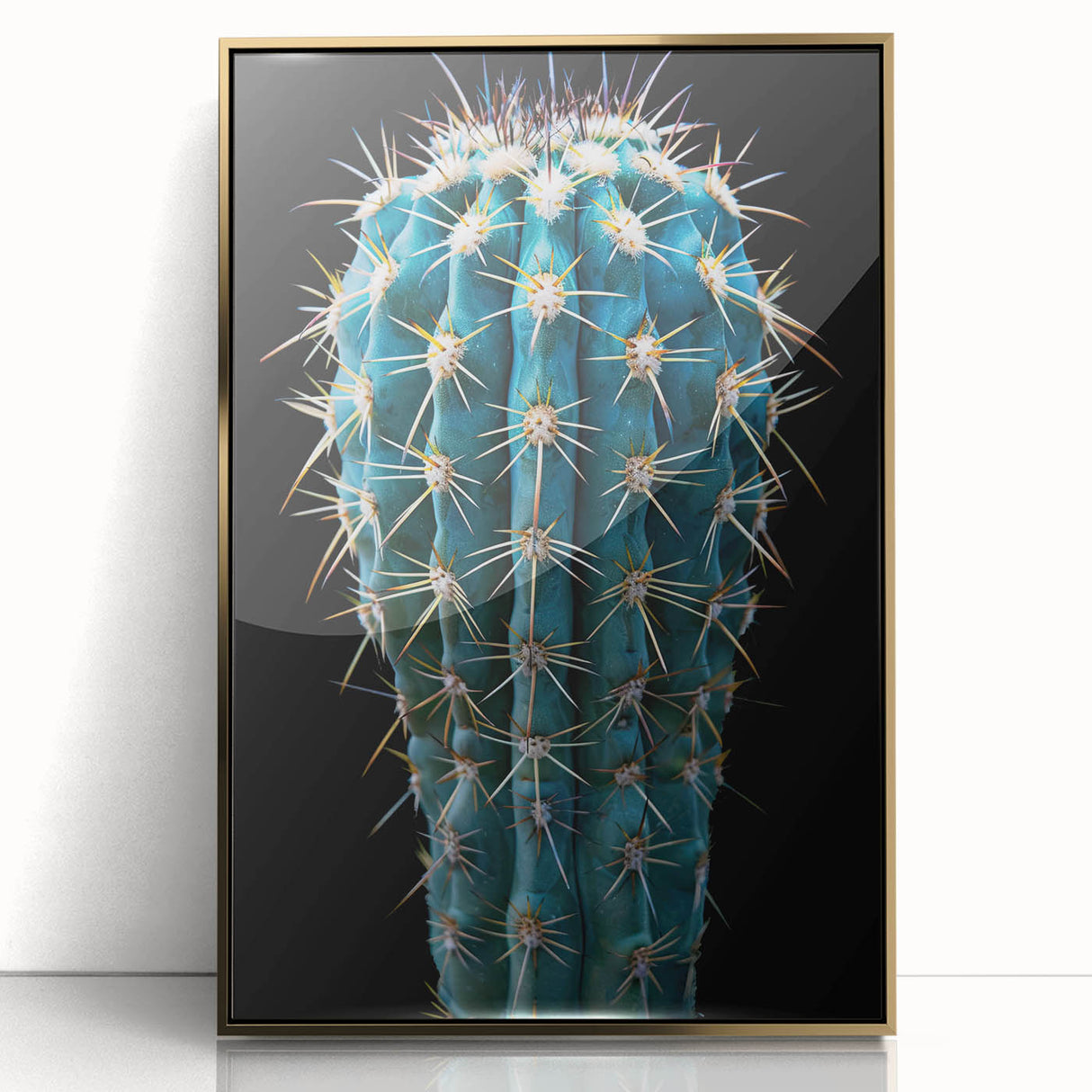 Framed wall art featuring a botanical cactus design with gold accents, showcasing vibrant green cacti against a neutral background, perfect for home decor.