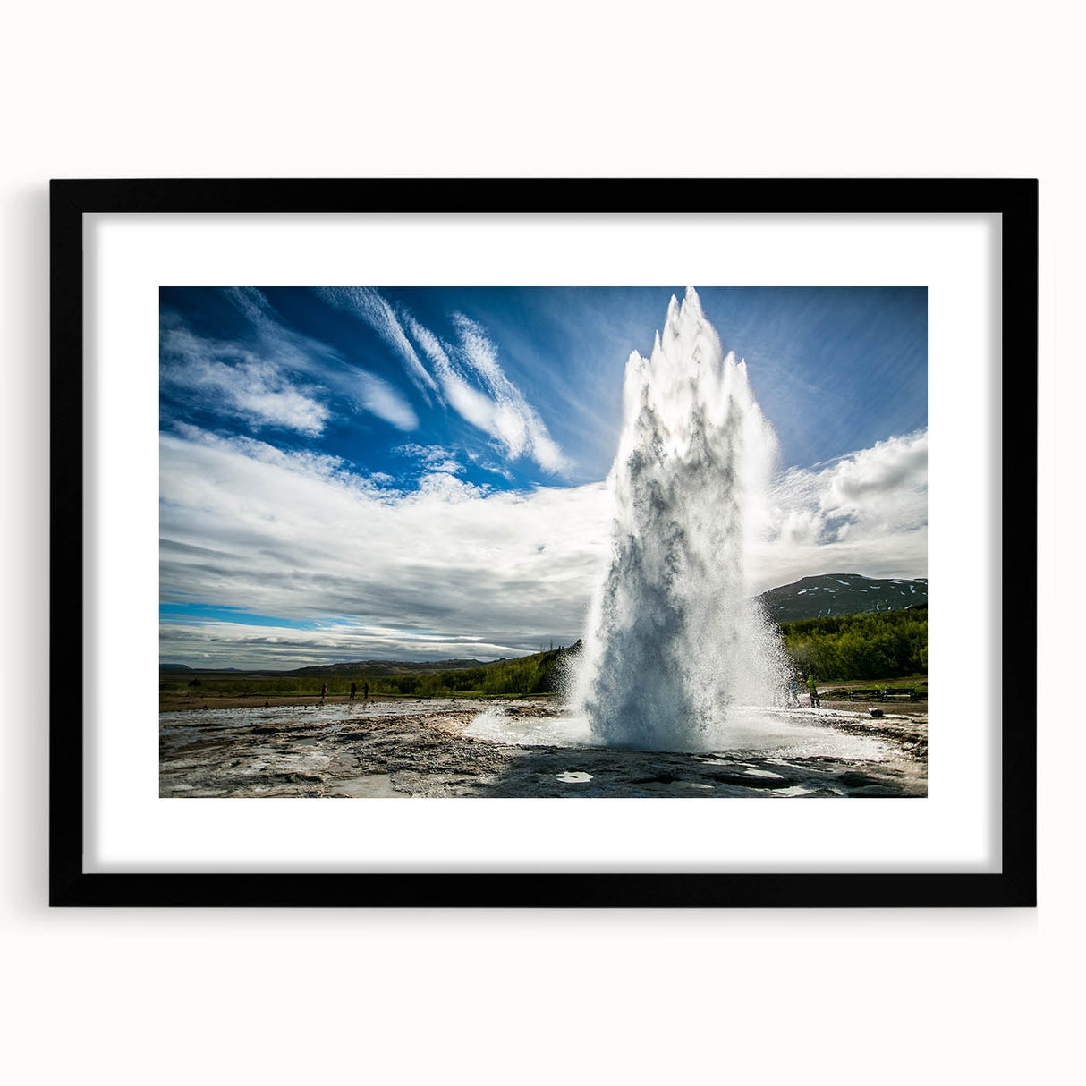 Framed landscape wall art showcasing a vibrant geyser design, featuring a sleek black frame and white mat, perfect for modern home decor.