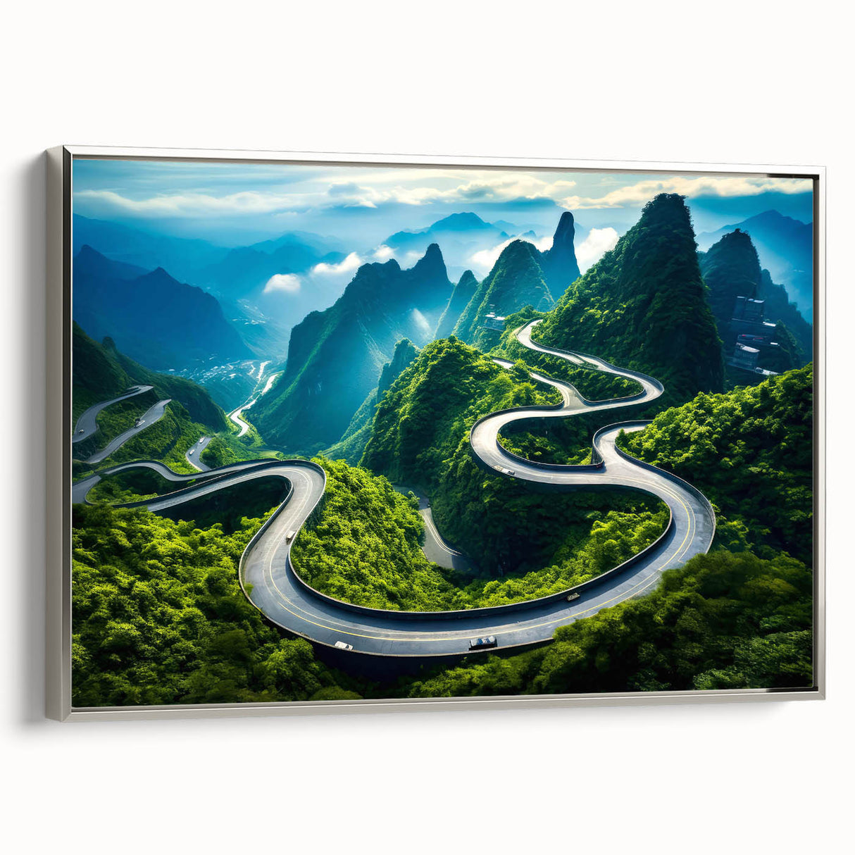 Framed canvas wall art featuring a scenic landscape with winding roads, displayed on a silver frame, perfect for enhancing home decor and adding depth to interiors.