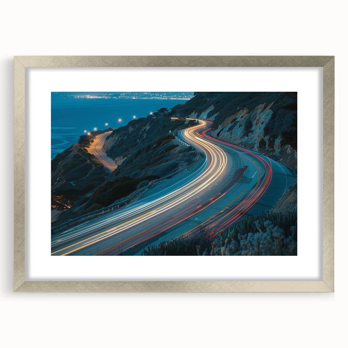 Framed wall art featuring a serene landscape with winding roads, presented in a silver frame with a mat, ideal for modern home decor. Perfect accent piece for living rooms or offices.