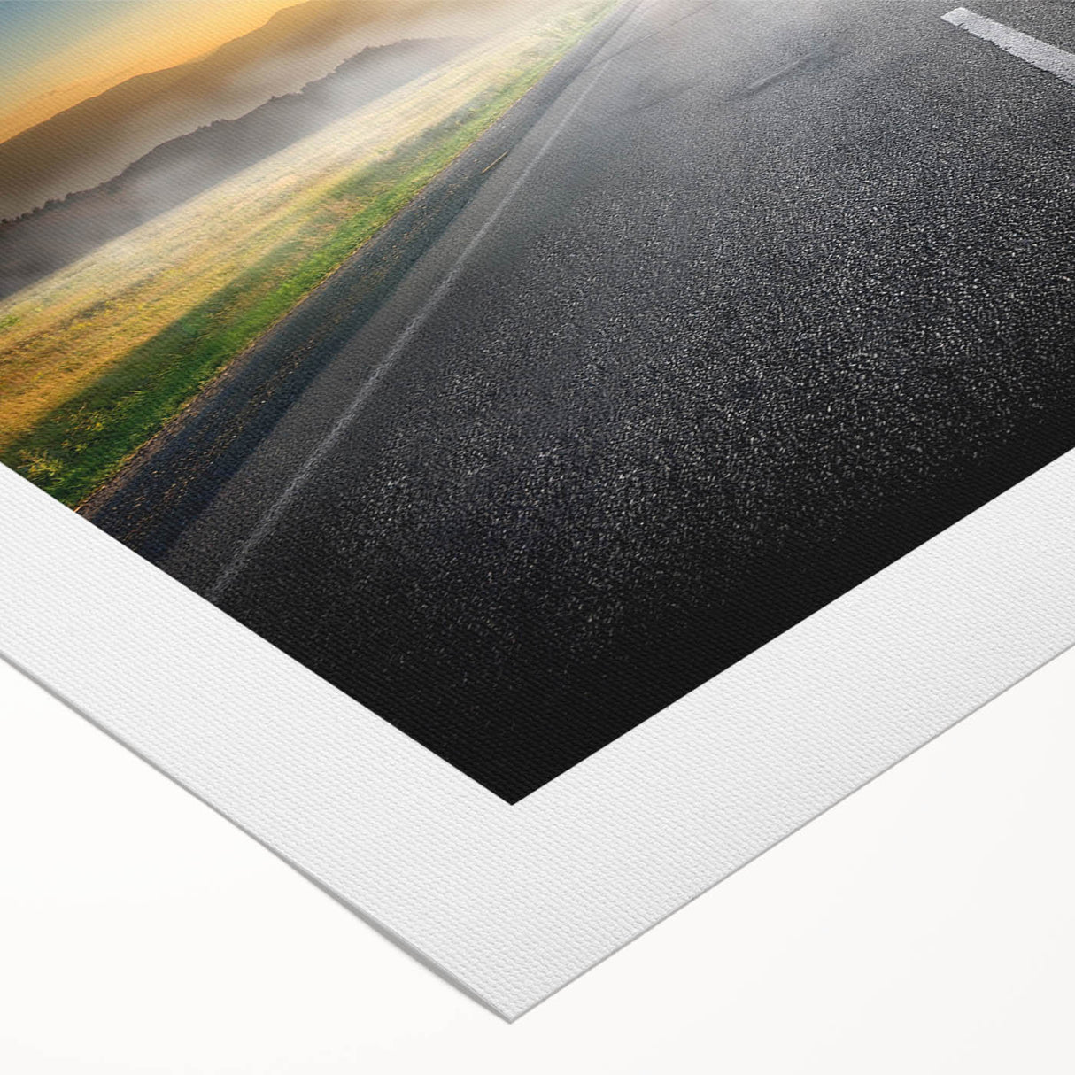 Vibrant rolled canvas artwork showcasing a scenic landscape with winding roads and lush greenery, perfect for home decor and aesthetic enhancement.