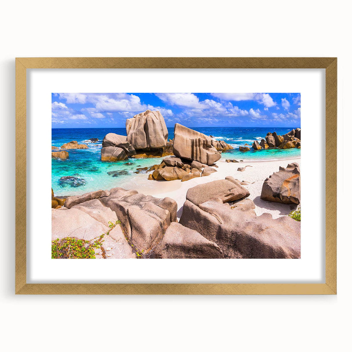 Framed wall art showcasing a serene landscape of rocks in natural tones, featuring a gold frame and mat, ideal for enhancing home decor.