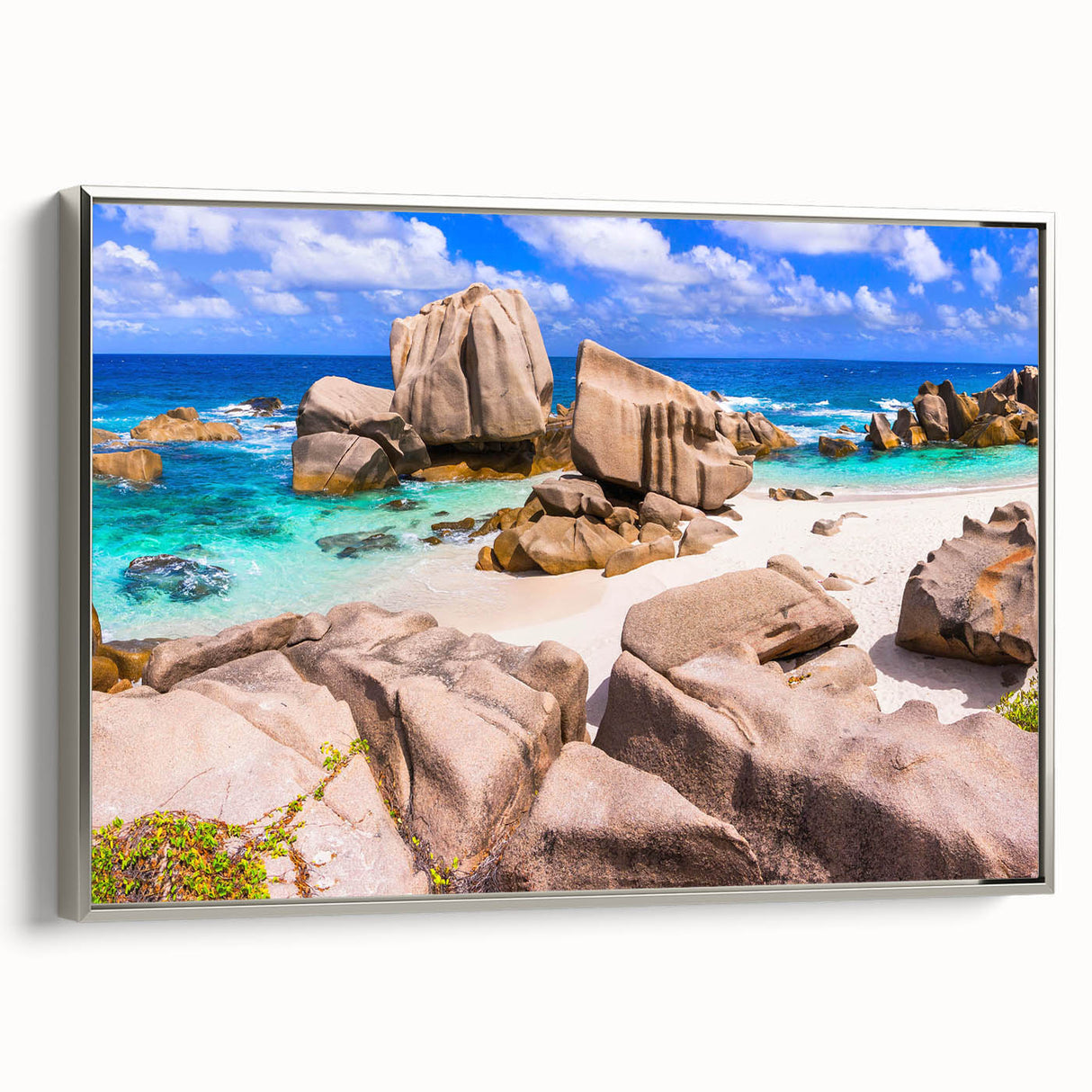 Framed canvas wall art showcasing a stunning landscape design with intricate rock formations, finished in a sleek silver frame, ideal for modern decor.