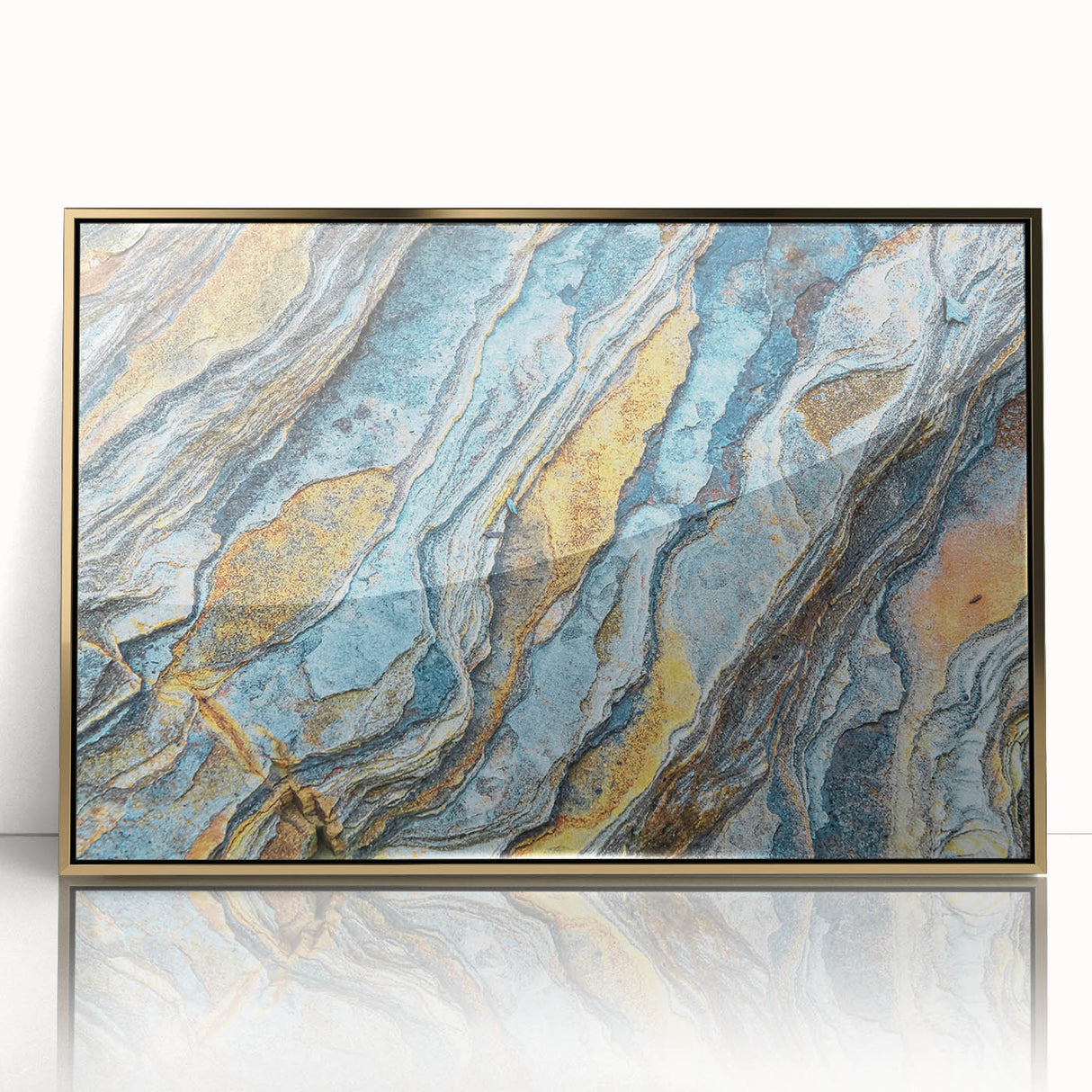Framed acrylic wall art showcasing a modern landscape design with vibrant colors and intricate rock formations, accented by a stylish gold frame, ideal for home decor.