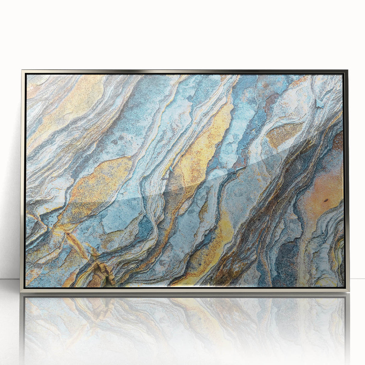Framed wall art featuring a contemporary landscape design with textured rocks and vibrant colors, elegantly displayed in a silver acrylic frame, perfect for modern decor.