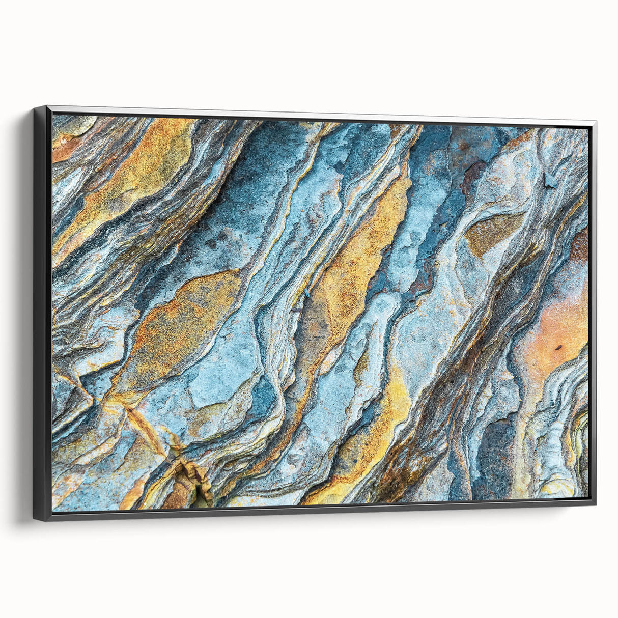 Framed canvas wall art depicting a stunning landscape design with rocky formations, featuring a black frame and side view showcasing its sleek profile, ideal for modern home decor.