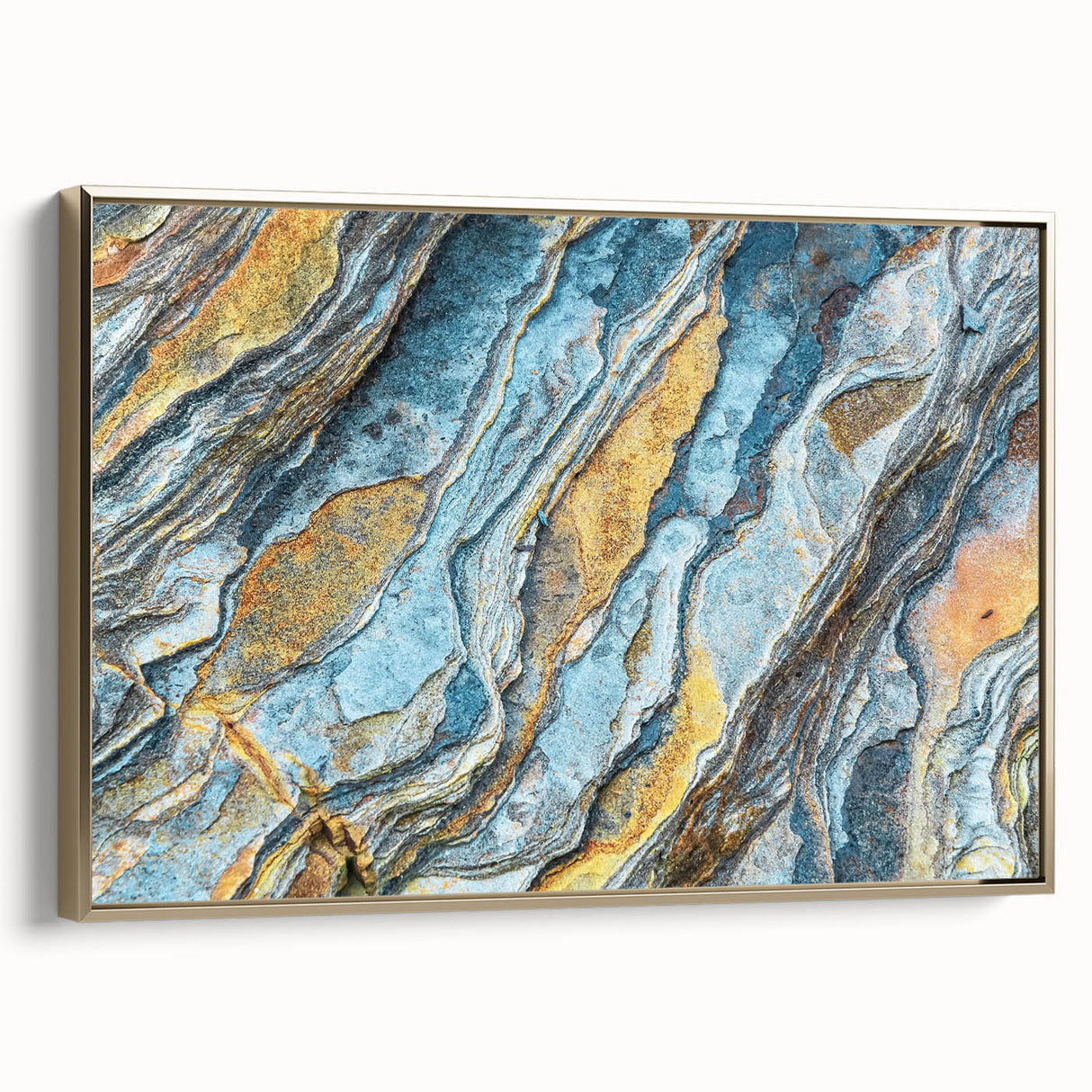 Framed canvas wall art showcasing a striking landscape design with rocky formations, accentuated by a gold frame, perfect for modern decor.