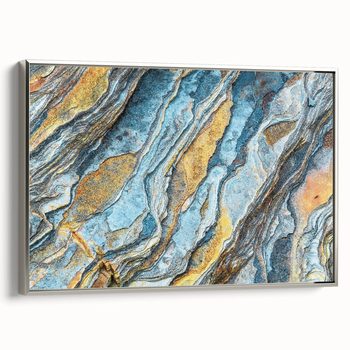 Framed wall art featuring a stunning landscape design with rocky formations, displayed in a silver frame. The artwork brings a sense of tranquility and natural beauty to any decor. Perfect for enhancing living spaces, this piece highlights intricate details and vibrant colors.