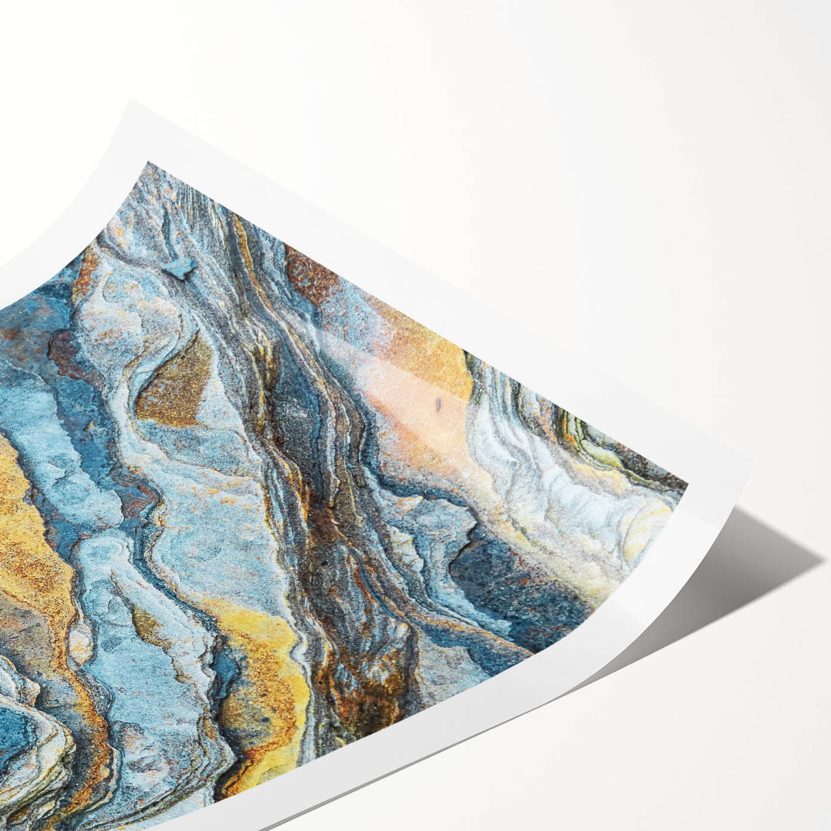 Abstract landscape wall art print showcasing vibrant colors and intricate rock formations, rolled for easy shipping and display in home decor.