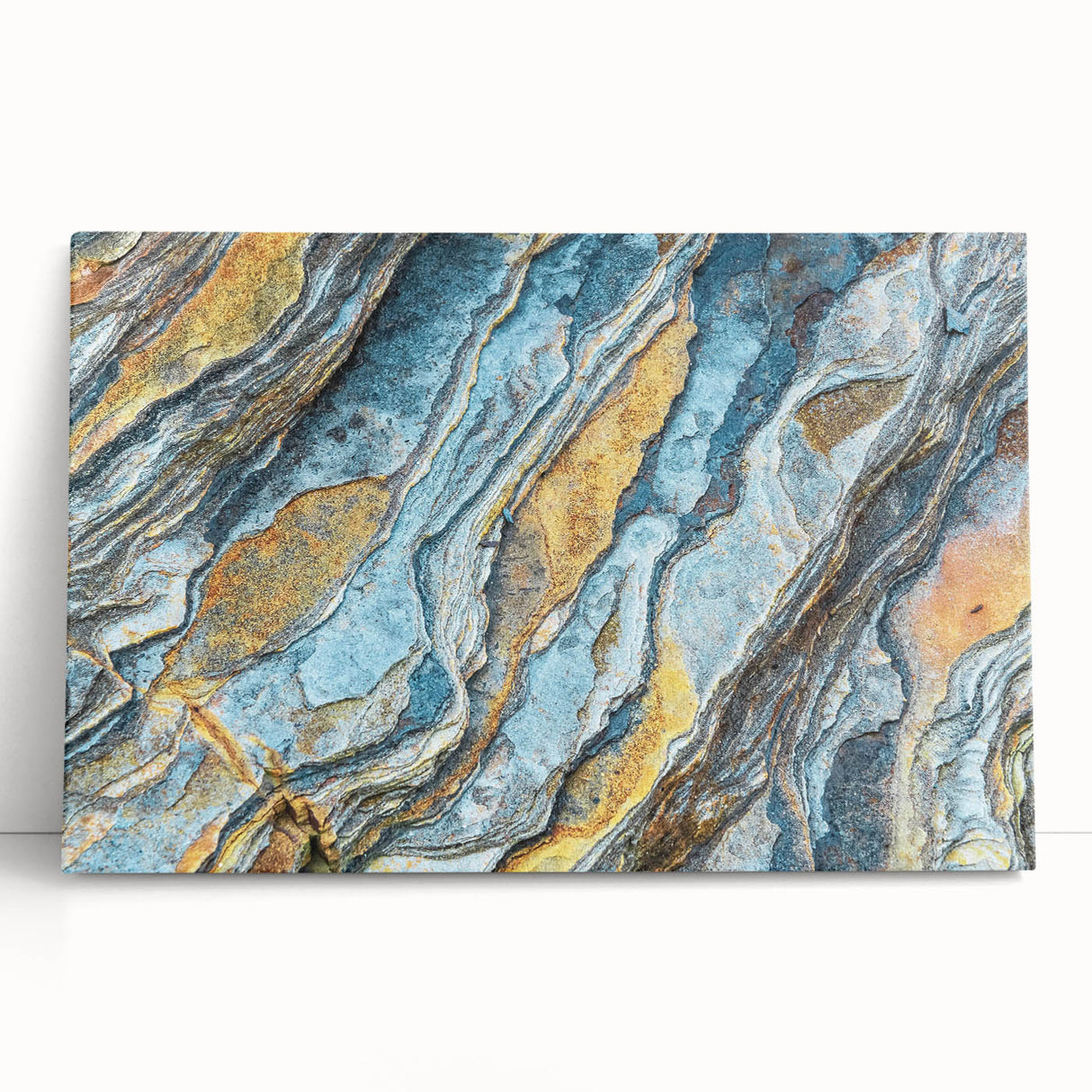 Stretched canvas wall art showcasing a vibrant abstract landscape design with bold colors and intricate rock formations, perfect for modern home decor.